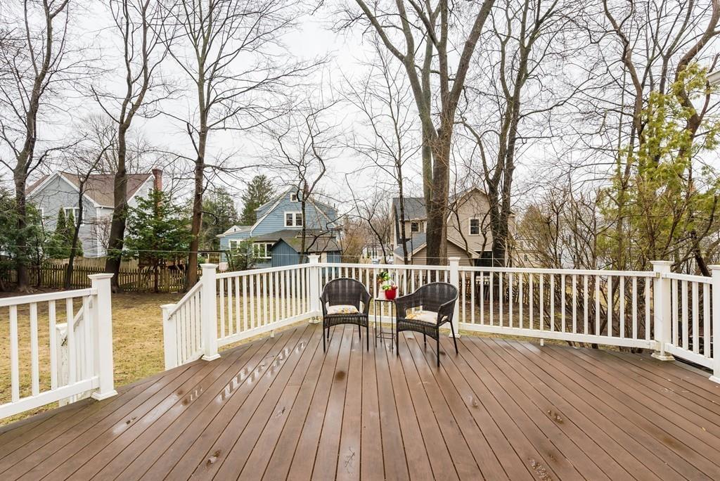104 Bertwell Road Lexington, MA 02420 - Photo 32 of 32 a view of a deck with table and chairs and wooden floor