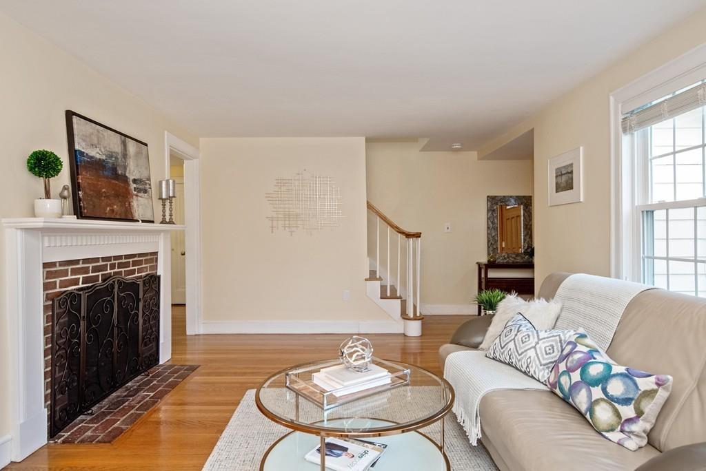 104 Bertwell Road Lexington, MA 02420 - Photo 5 of 32 a living room with furniture and a fireplace