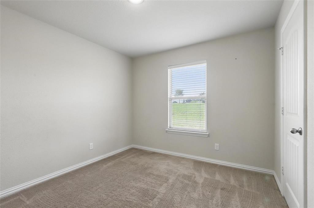 240 Springwood Ranch Loop Springtown, TX 76082 - Photo 18 of 27 an empty room with a window