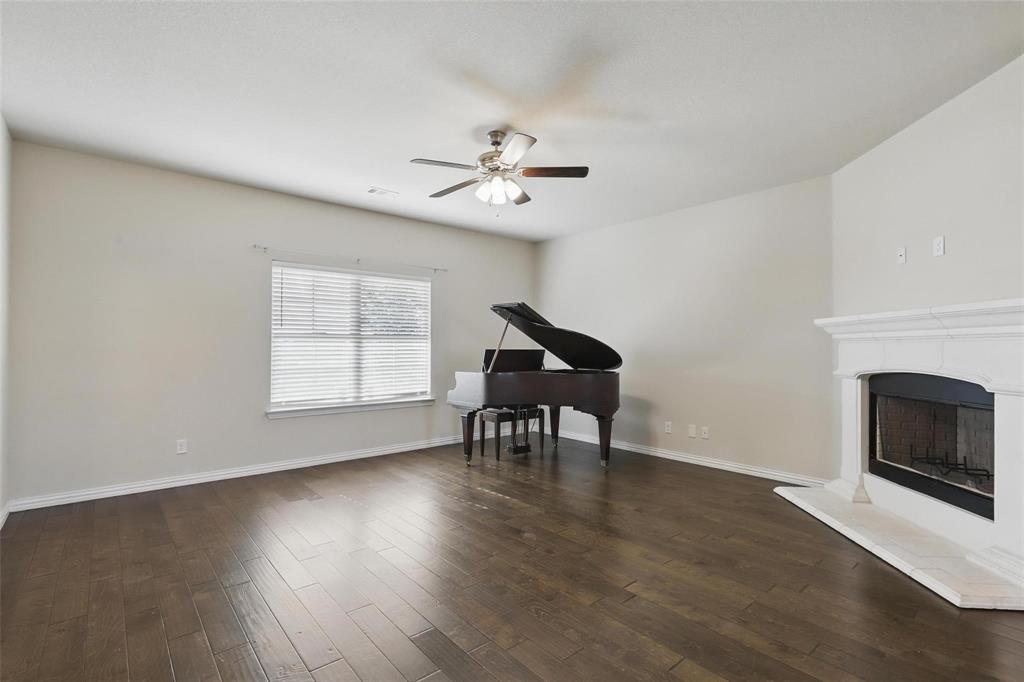 240 Springwood Ranch Loop Springtown, TX 76082 - Photo 5 of 27 a view of a livingroom with furniture and a fireplace