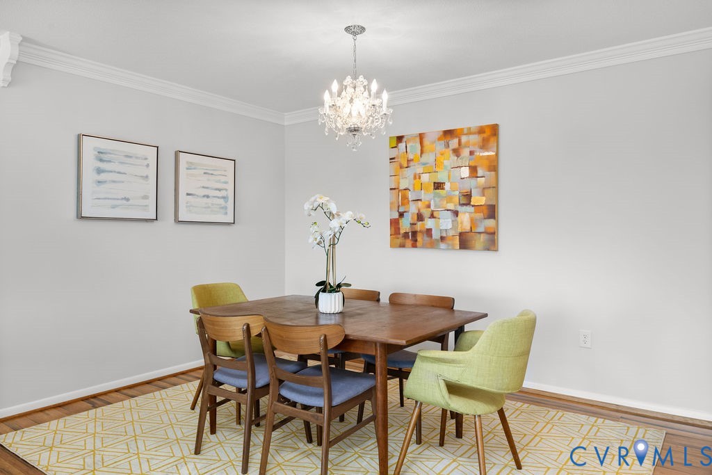 2956 Hathaway Road, Unit U704 Richmond, VA 23225 - Photo 7 of 42 Dining area featuring a crystal chandelier, crown