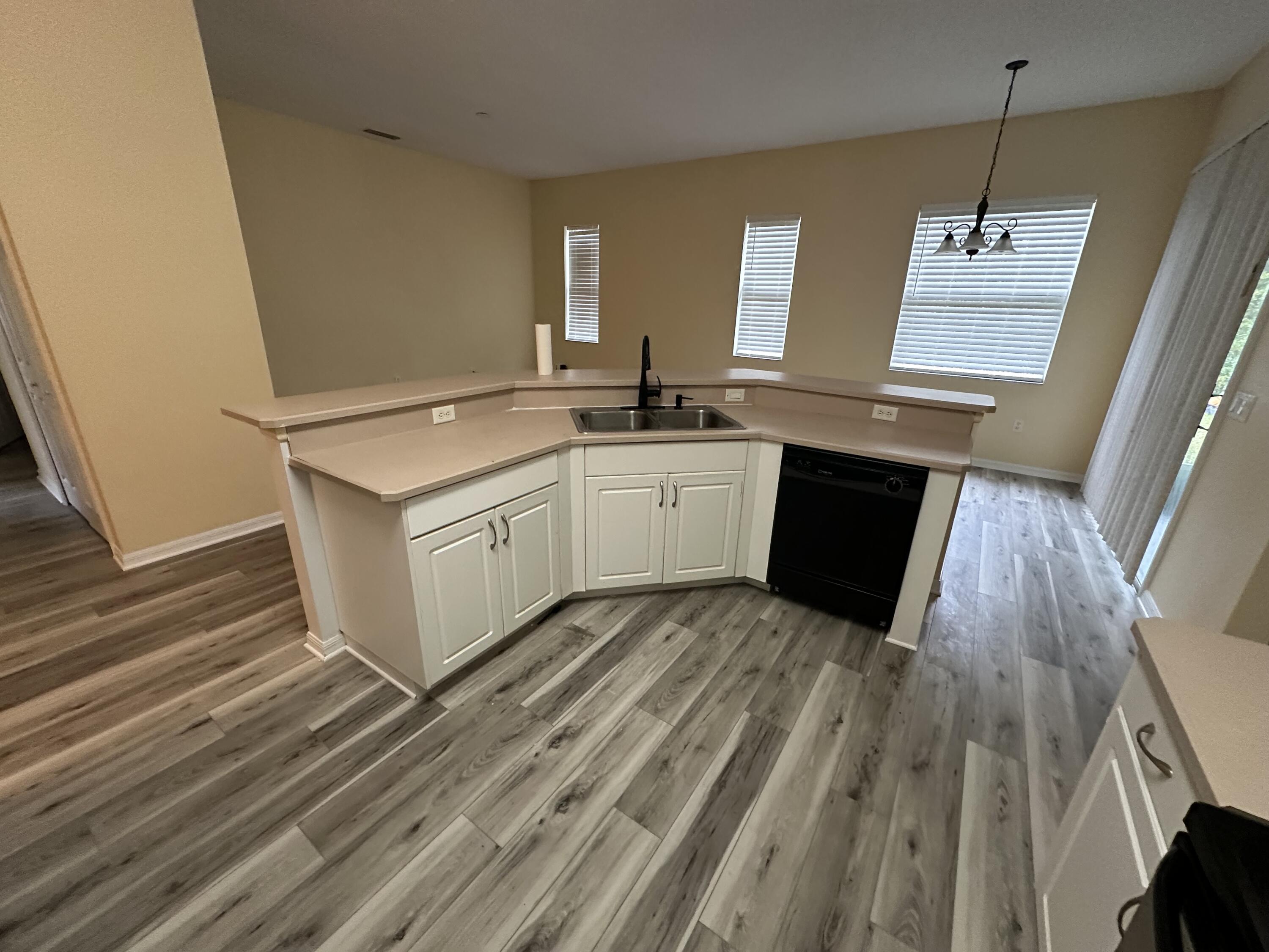 931 Dorchester Road Palm Bay, FL 32907 - Photo 11 of 13 a view of a kitchen with sink and dishwasher