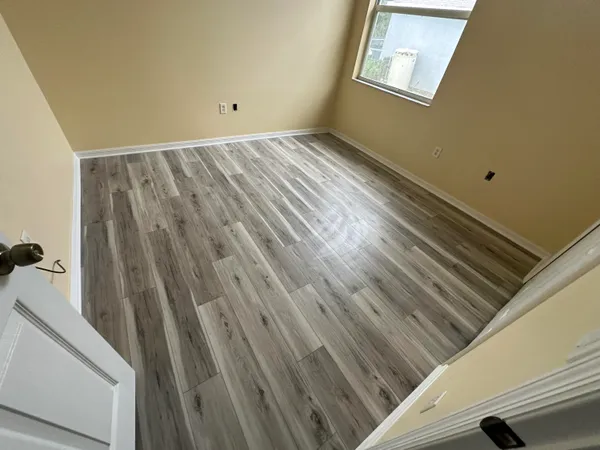 a view of wooden floor in a bathroom