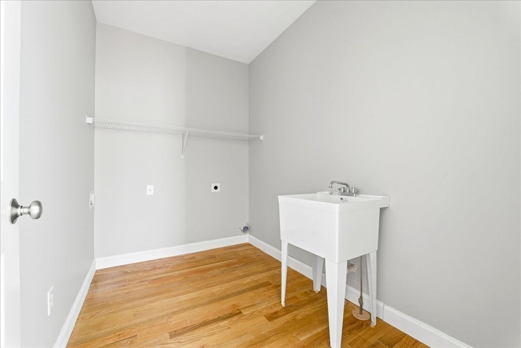 99 Maple Street Douglas, MA 01516 - Photo 12 of 24 a room with a table and chandelier
