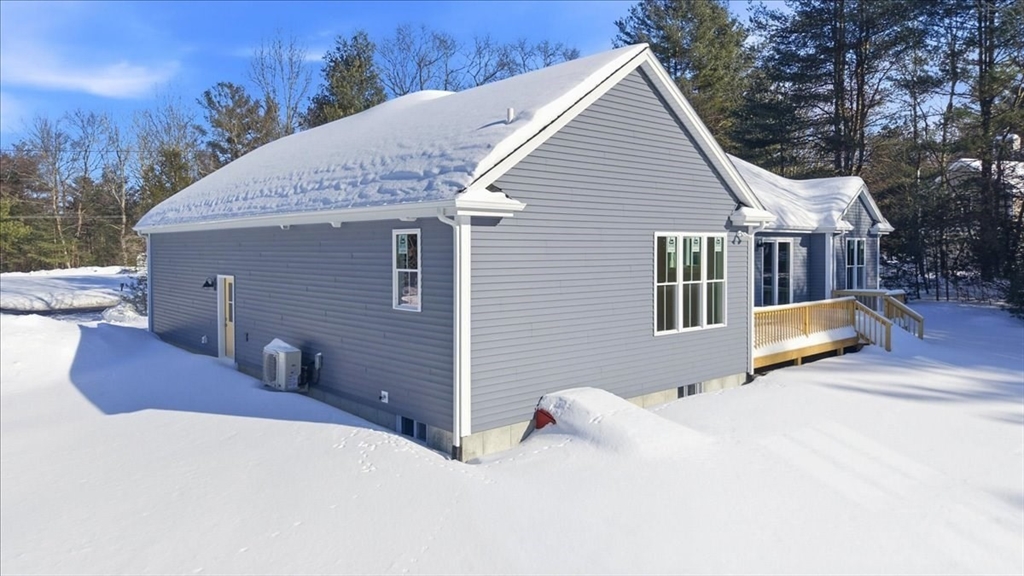 99 Maple Street Douglas, MA 01516 - Photo 21 of 24 a view of a house with a yard and seating space