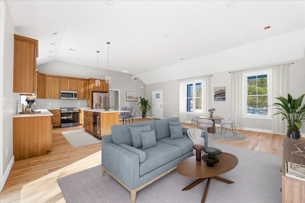 99 Maple Street Douglas, MA 01516 - Photo 3 of 24 a living room with furniture kitchen view and a large window