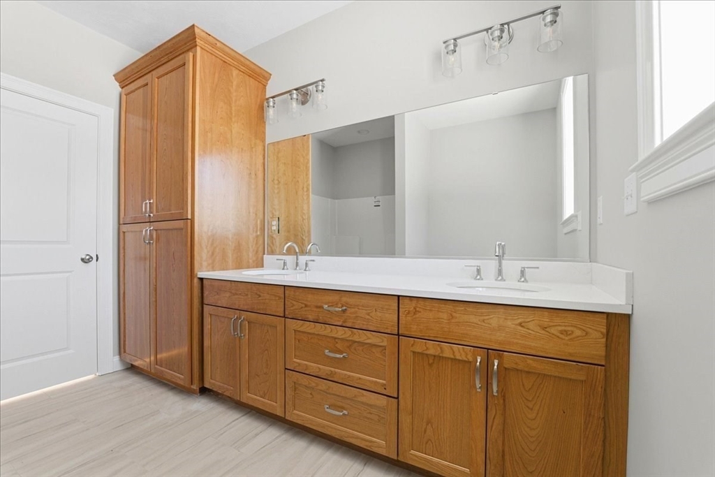 99 Maple Street Douglas, MA 01516 - Photo 5 of 24 a bathroom with a double vanity sink and mirror