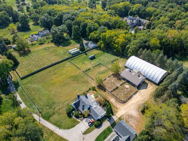 an aerial view of residential house with outdoor space