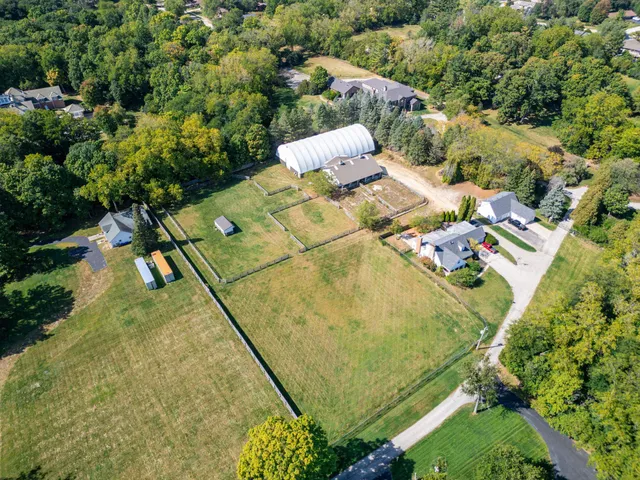 a view of a swimming pool with a yard