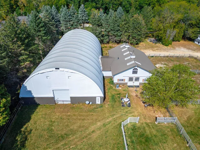 a view of patio with a table and chairs under an umbrella