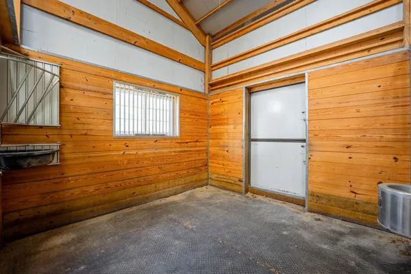 a view of a big room with windows
