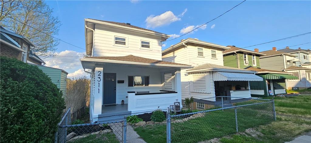 2311 Clinton Street Homestead, PA 15120 - Photo 1 of 38 a front view of a house with a yard