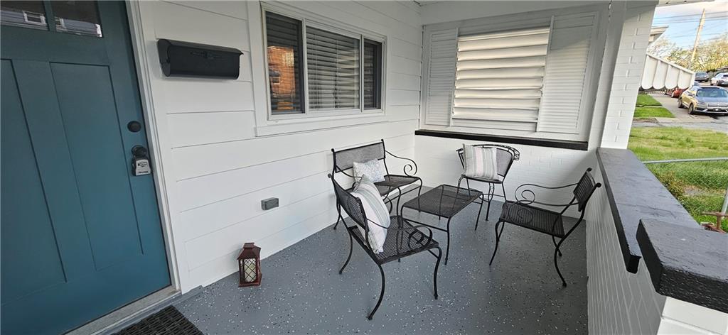 2311 Clinton Street Homestead, PA 15120 - Photo 2 of 38 a patio with table and chairs