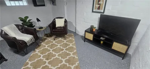a floor to ceiling window and potted plant on a table