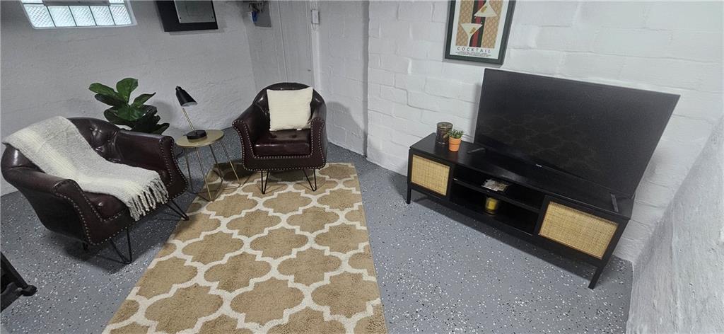 2311 Clinton Street Homestead, PA 15120 - Photo 22 of 38 a living room with furniture and a flat screen tv