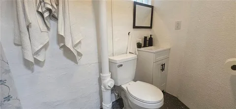 a bathroom with a shower and a sink