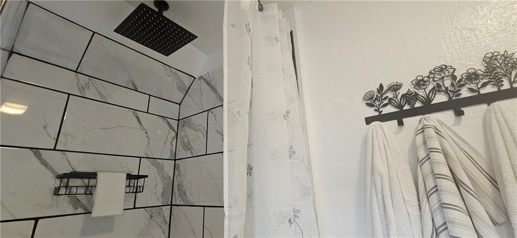 2311 Clinton Street Homestead, PA 15120 - Photo 26 of 38 a bathroom with a shower and a sink