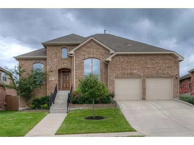 1315 Rimstone Drive Cedar Park, TX 78613 - Photo 1 of 1 a front view of a house with a yard