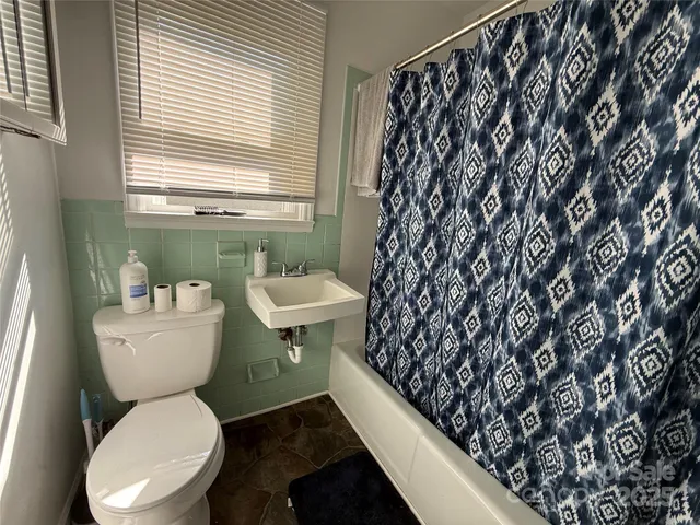 a bathroom with a toilet and a sink