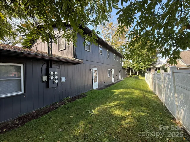 a backyard of a house with lots of green space