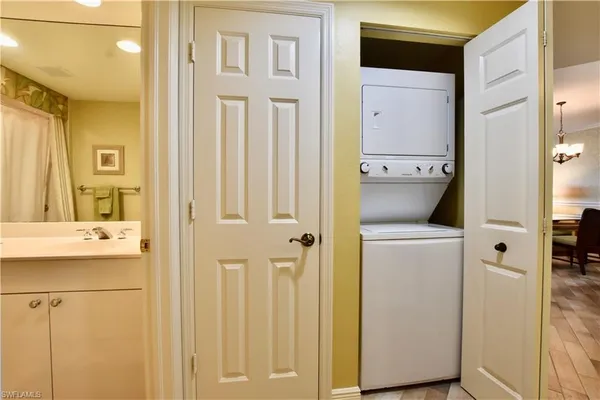 a view of bathroom with a sink and mirror