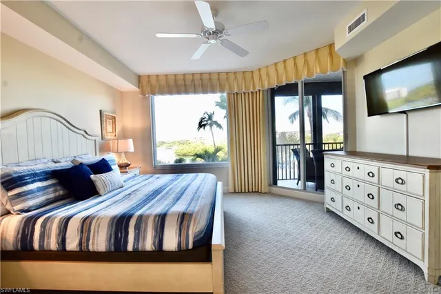 a living room with furniture fireplace and flat screen tv
