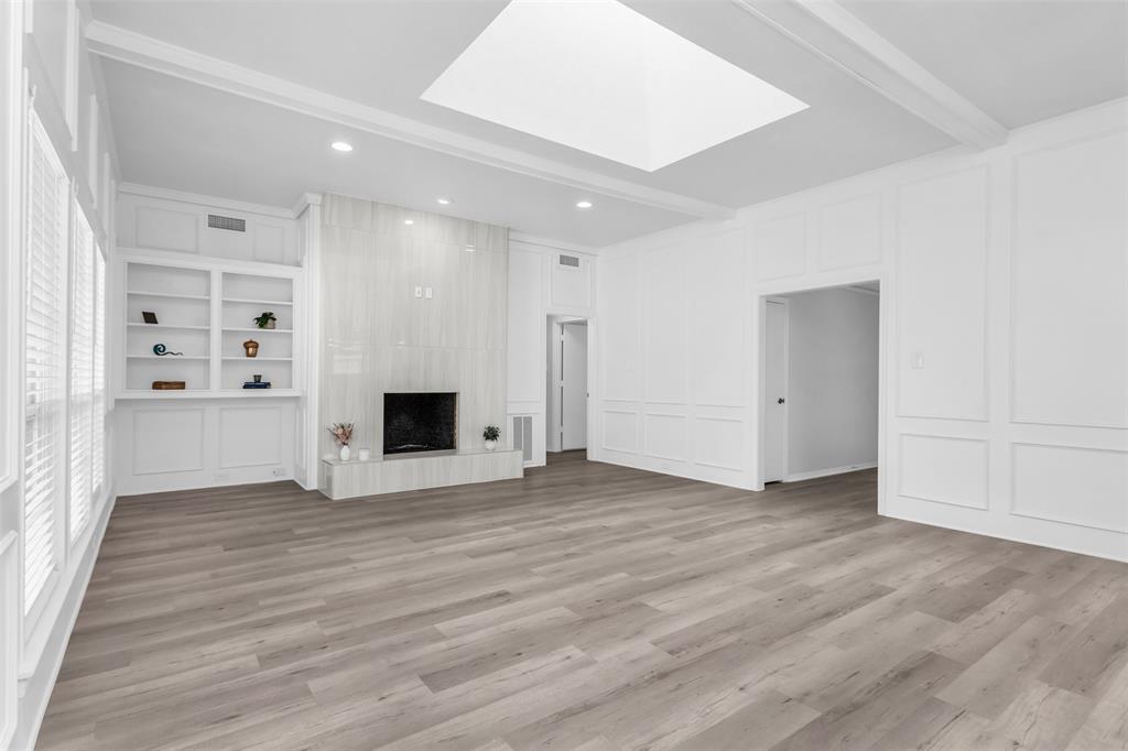 7233 Rustic Valley Drive Dallas, TX 75248 - Photo 3 of 21 a view of empty room with wooden floor