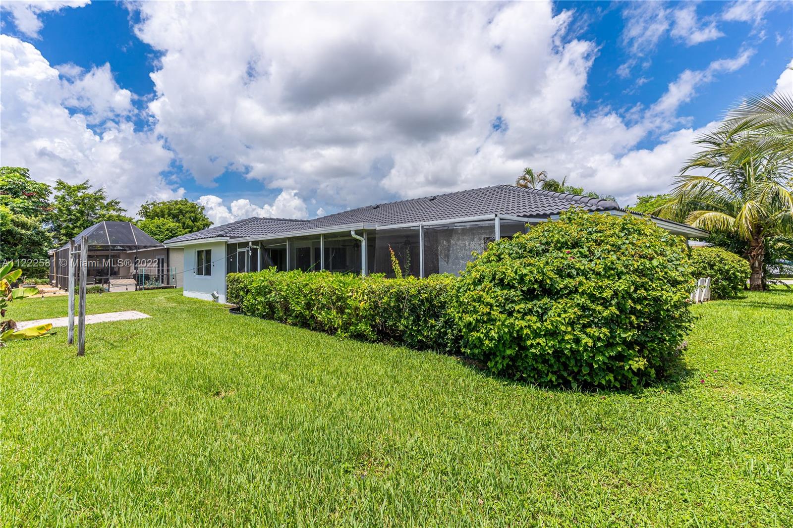 10820 Eureka Street Boca Raton, FL 33428 - Photo 18 of 39 a view of house with garden
