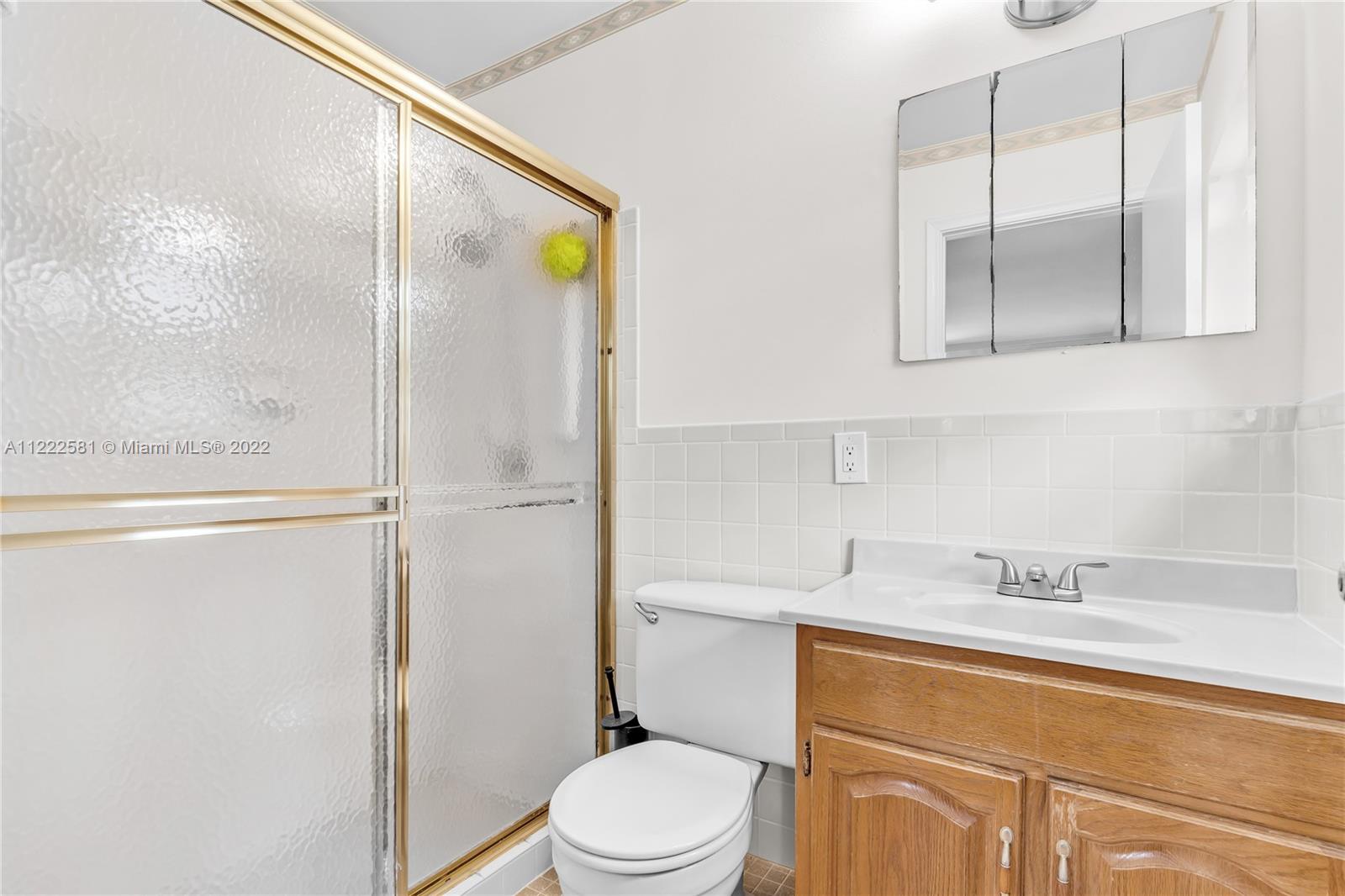10820 Eureka Street Boca Raton, FL 33428 - Photo 34 of 39 a bathroom with a sink a toilet and shower