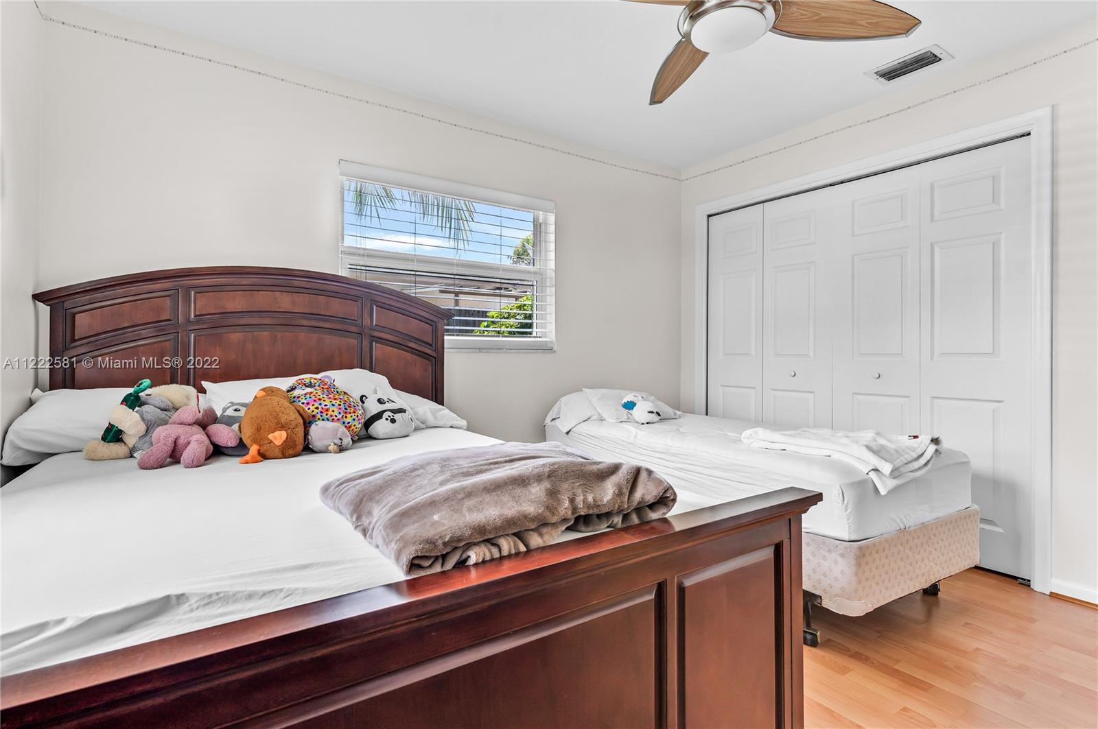 10820 Eureka Street Boca Raton, FL 33428 - Photo 36 of 39 a bedroom with two bed and a window