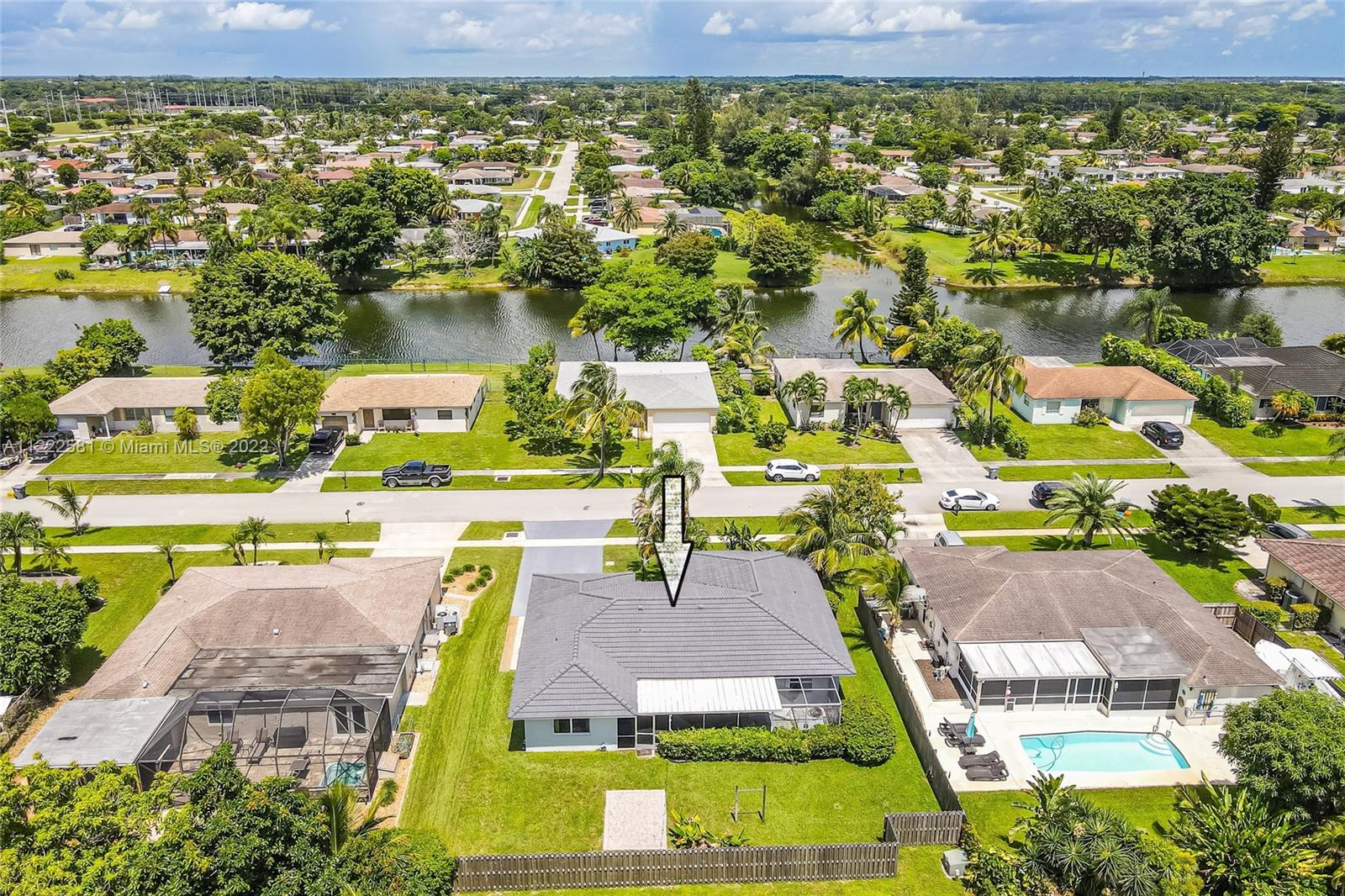10820 Eureka Street Boca Raton, FL 33428 - Photo 5 of 39 an aerial view of a house with a swimming pool outdoor seating and yard