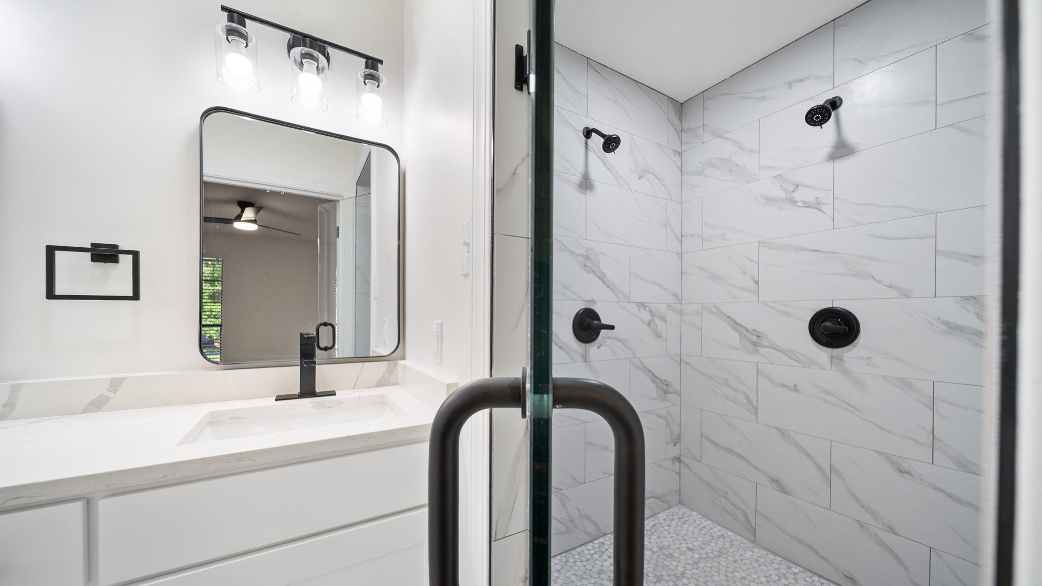 4351 Spring Oak Cove Memphis, TN 38125 - Photo 23 of 40 a bathroom with a sink and a mirror
