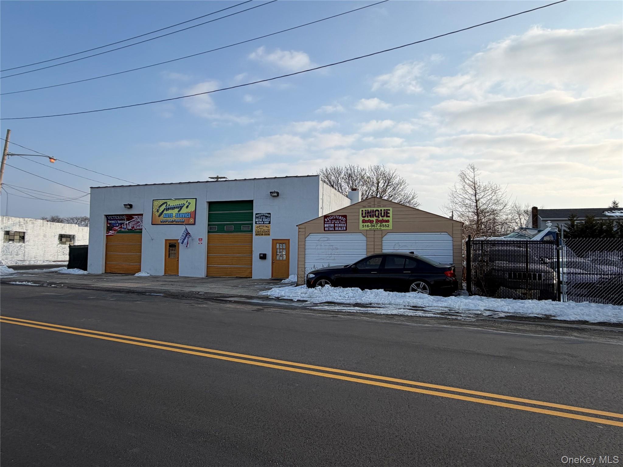 a view of a building with car parked