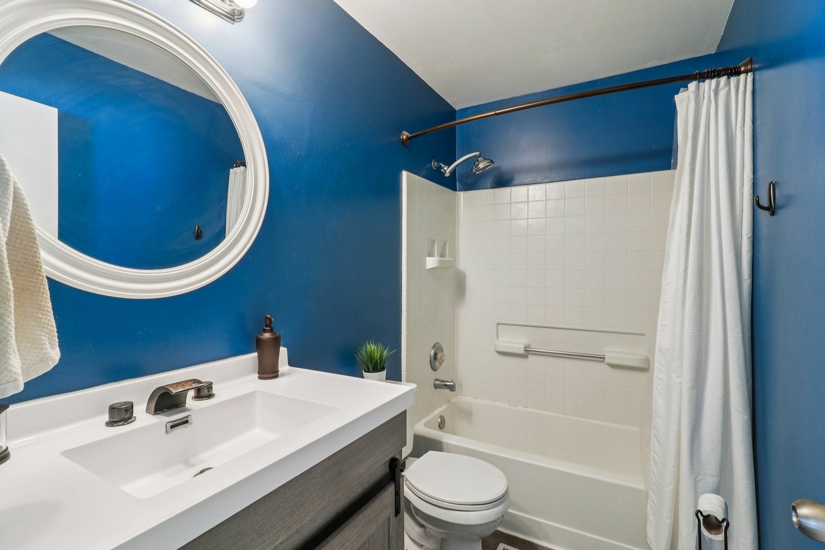 47 South Treehouse Lane Round Lake, IL 60073 - Photo 13 of 23 a bathroom with a sink and a mirror