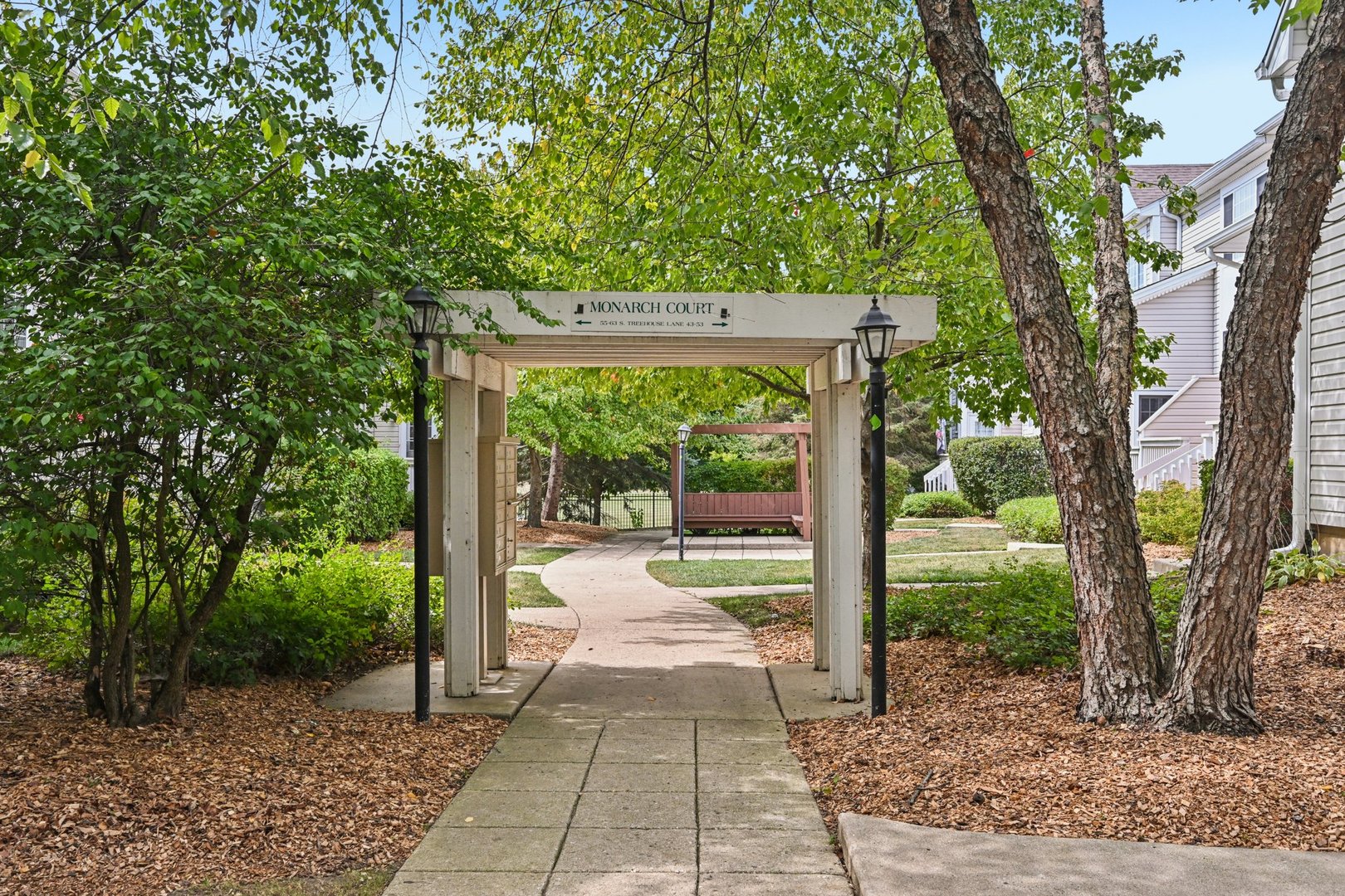 47 South Treehouse Lane Round Lake, IL 60073 - Photo 21 of 23 a view of backyard with large tree and wooden fence