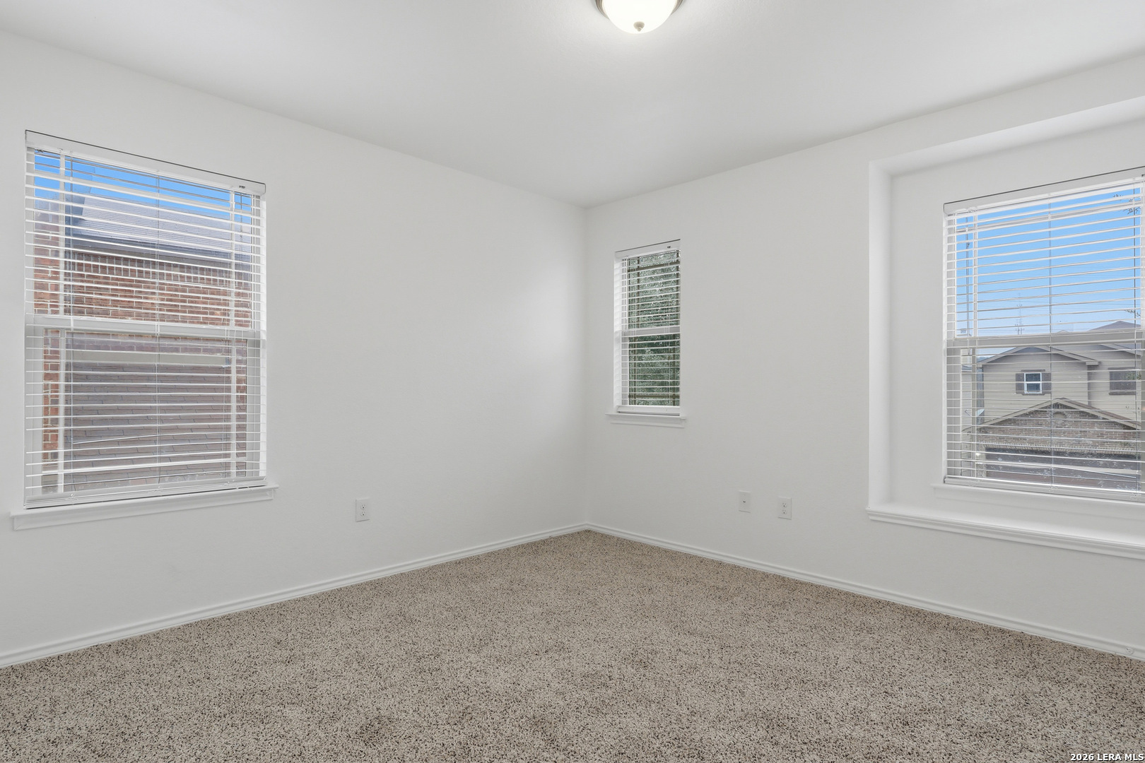 9819 Hawk Shore Converse, TX 78109 - Photo 19 of 26 a view of an empty room with a window