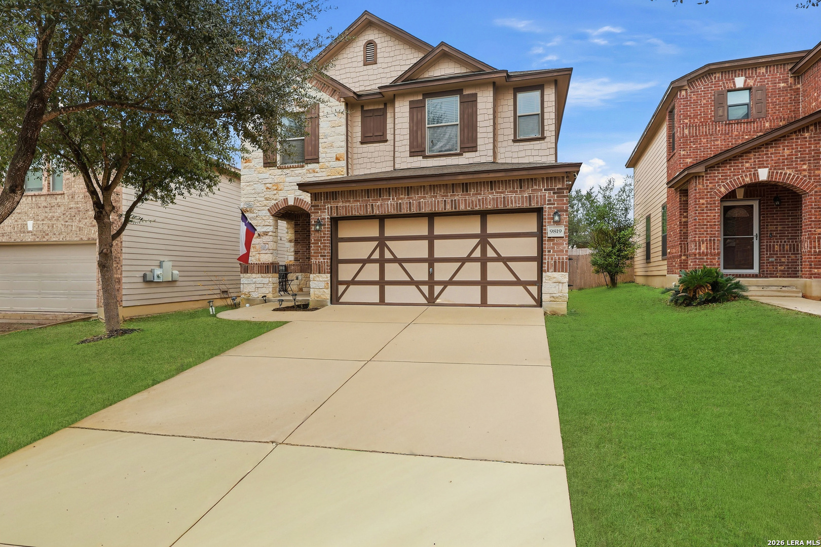 9819 Hawk Shore Converse, TX 78109 - Photo 2 of 26 a front view of a house with a yard