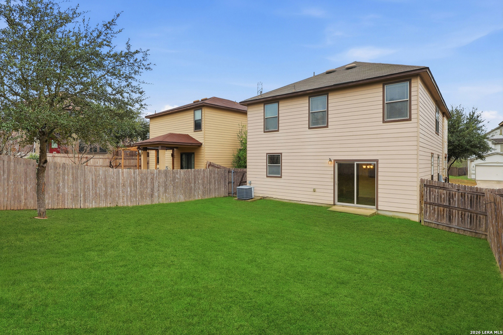 9819 Hawk Shore Converse, TX 78109 - Photo 23 of 26 a front view of a house with a garden