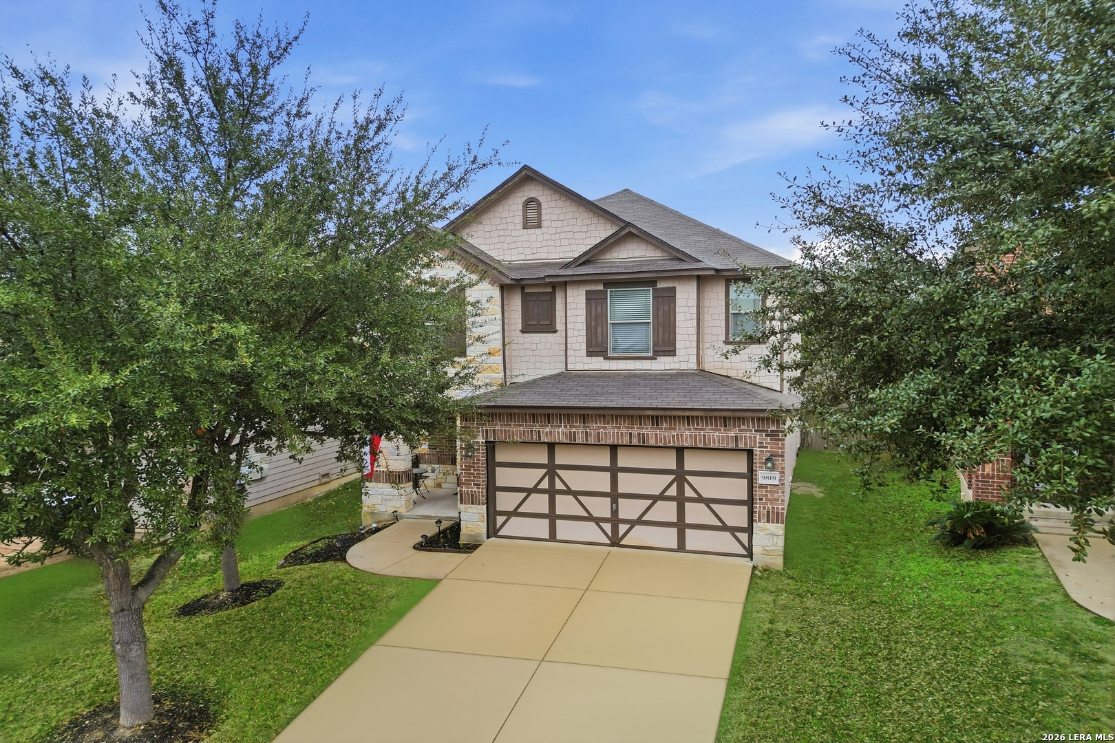 9819 Hawk Shore Converse, TX 78109 - Photo 24 of 26 a front view of a house with a yard