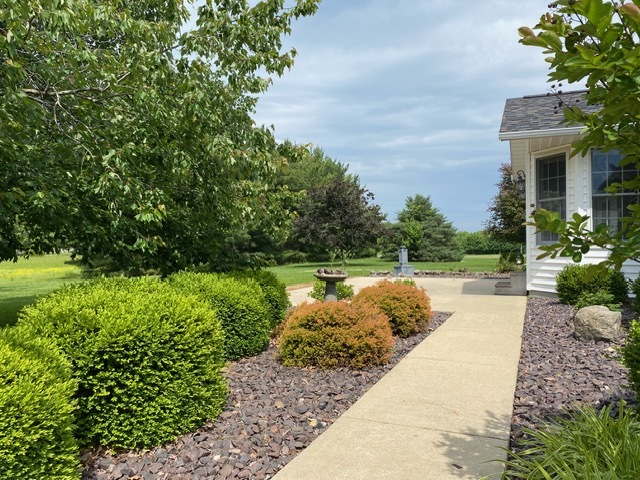 11426 East Radisson Road Mount Vernon, IL 62864 - Photo 49 of 56 a view of a garden with plants and large trees