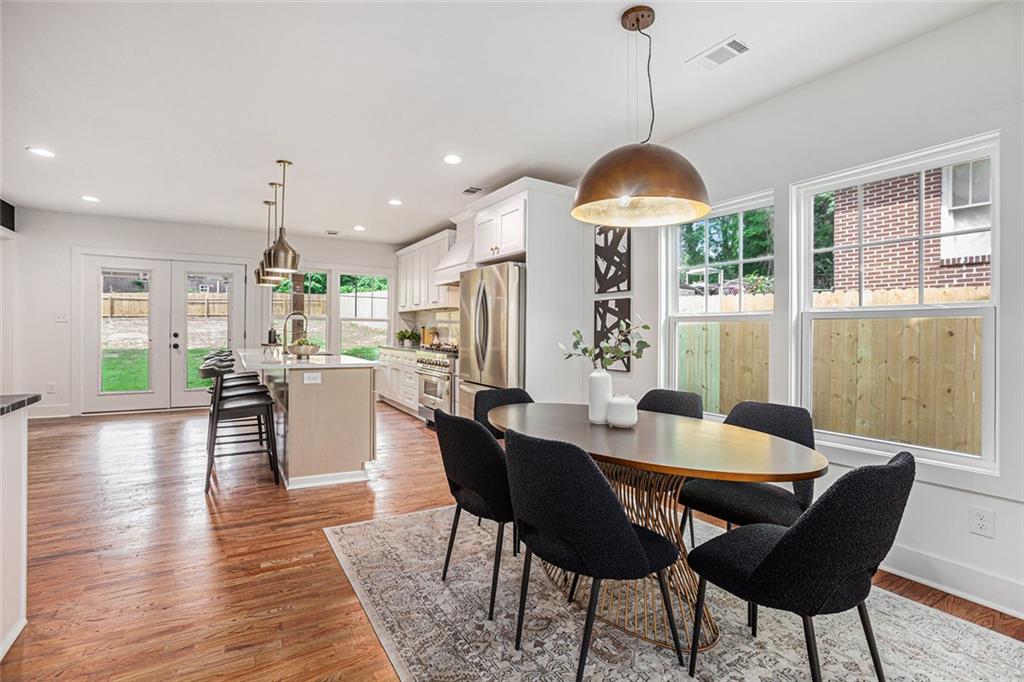 1721 South Gordon Street Southwest Atlanta, GA 30310 - Photo 14 of 44 a dining room with furniture window and wooden floor