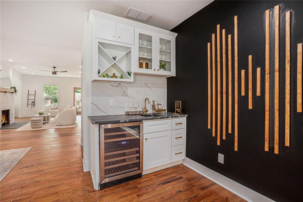 1721 South Gordon Street Southwest Atlanta, GA 30310 - Photo 19 of 44 a kitchen with stainless steel appliances granite countertop a stove and a refrigerator