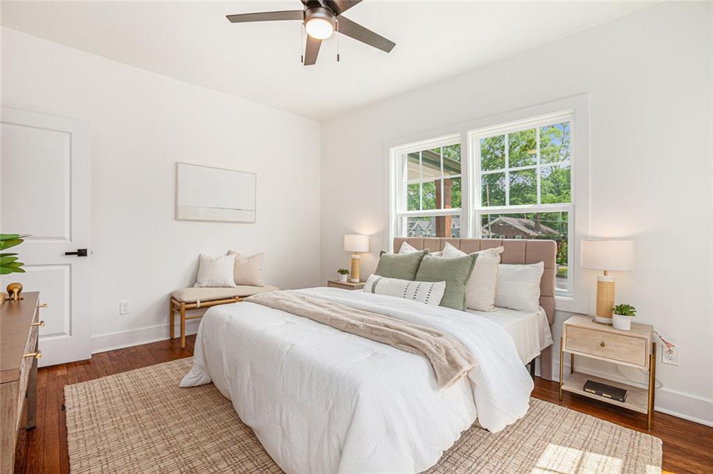 1721 South Gordon Street Southwest Atlanta, GA 30310 - Photo 20 of 44 a bedroom with a bed and a night stand