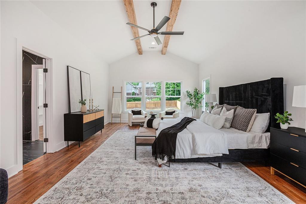1721 South Gordon Street Southwest Atlanta, GA 30310 - Photo 21 of 44 a bedroom with a bed a large window and flat screen tv
