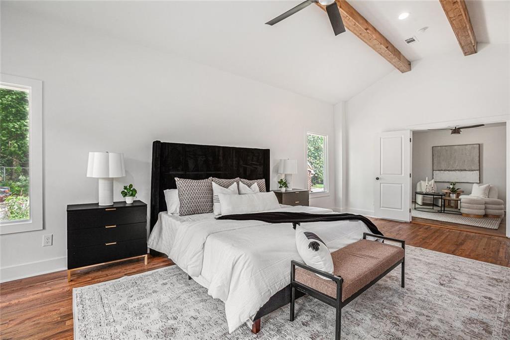 1721 South Gordon Street Southwest Atlanta, GA 30310 - Photo 23 of 44 a spacious bedroom with a bed and wooden floor