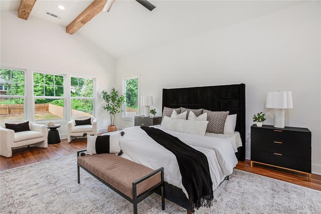 1721 South Gordon Street Southwest Atlanta, GA 30310 - Photo 25 of 44 a spacious bedroom with a bed and a couch