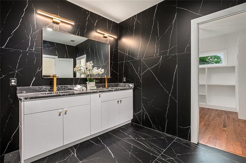 1721 South Gordon Street Southwest Atlanta, GA 30310 - Photo 30 of 44 a bathroom with double vanity and a mirror