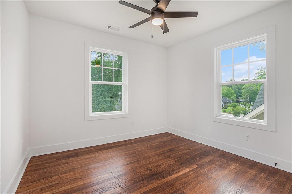 1721 South Gordon Street Southwest Atlanta, GA 30310 - Photo 35 of 44 a view of a big room with wooden floor and windows