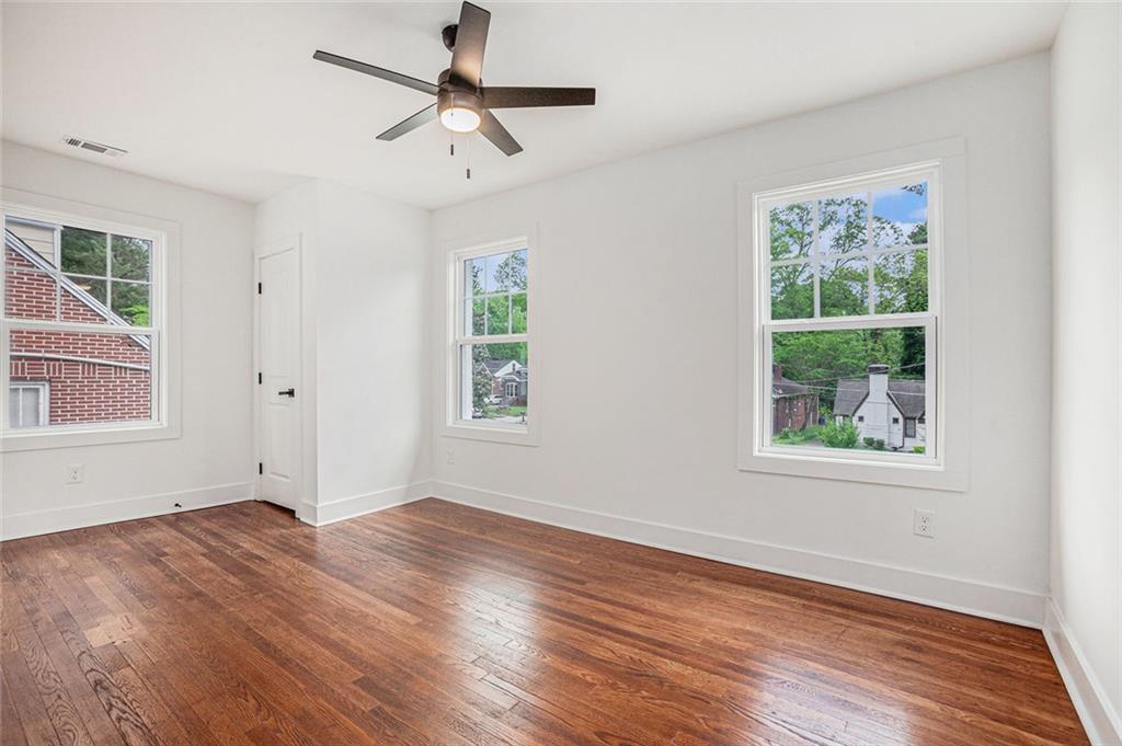 1721 South Gordon Street Southwest Atlanta, GA 30310 - Photo 36 of 44 a view of an empty room with wooden floor and a window