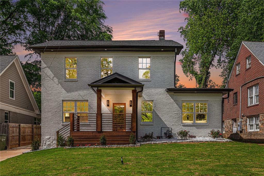 1721 South Gordon Street Southwest Atlanta, GA 30310 - Photo 4 of 44 a front view of a house with a yard